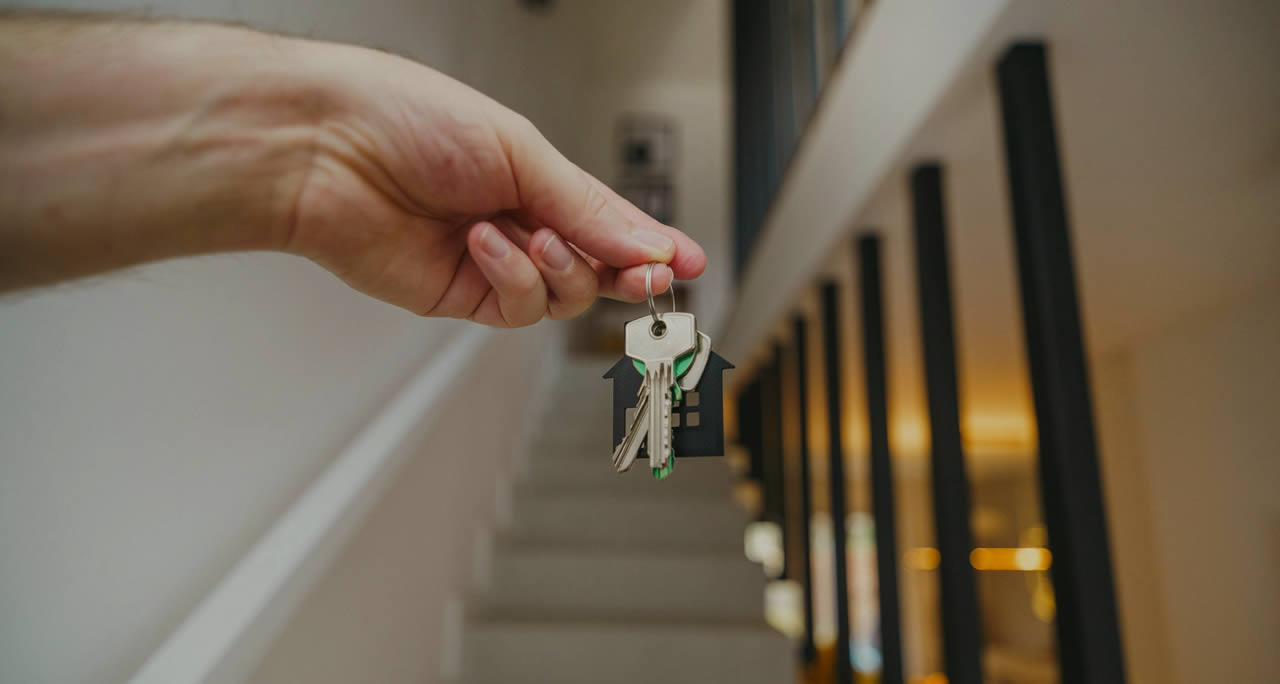 Selective photo of keys being handed over for new property